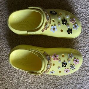 Yellow, women’s crush clog, size 12 with added gems/jibitz that are removable.